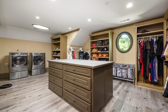 2740 Drayton Hall Dr, Buford, GA 30519 - walk in closet featuring light wood-style flooring, visible vents, and washing machine and clothes dryer