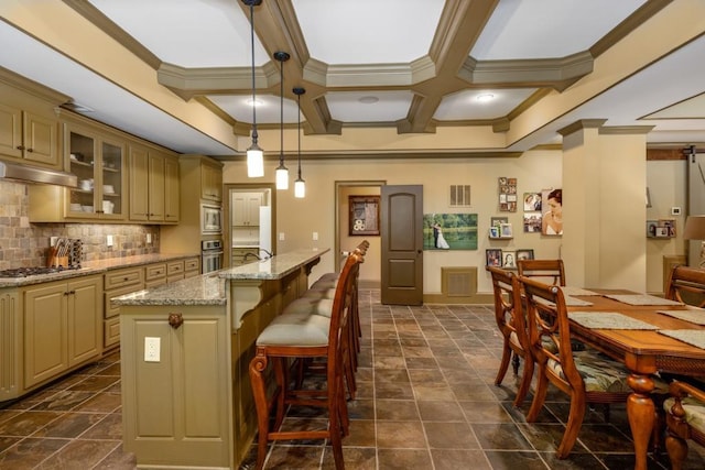 2740 Drayton Hall Dr, Buford, GA 30519 - kitchen with ornamental molding, glass insert cabinets, cream cabinets, coffered ceiling, and stainless steel appliances
