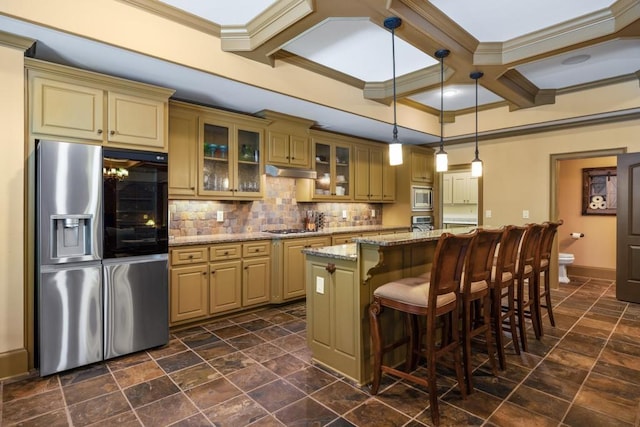 2740 Drayton Hall Dr, Buford, GA 30519 - kitchen with ornamental molding, cream cabinetry, under cabinet range hood, stainless steel appliances, and coffered ceiling