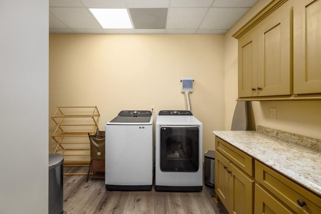 2740 Drayton Hall Dr, Buford, GA 30519 - laundry area with washing machine and dryer, light wood-type flooring, and cabinet space