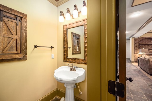 2740 Drayton Hall Dr, Buford, GA 30519 - bathroom with baseboards, a sink, and ornamental molding
