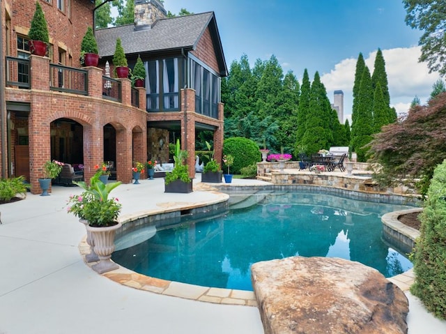 2740 Drayton Hall Dr, Buford, GA 30519 - outdoor pool featuring a patio and a sunroom