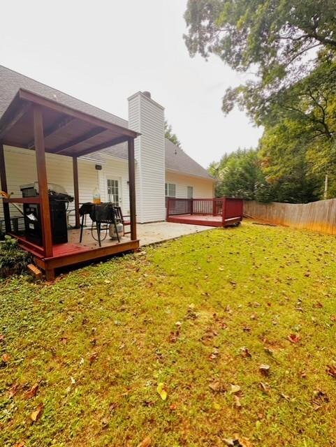 view of yard featuring a wooden deck