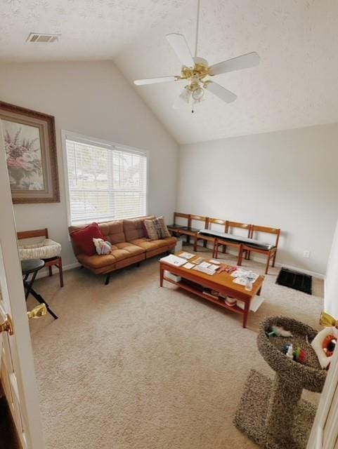 carpeted living room with vaulted ceiling and ceiling fan