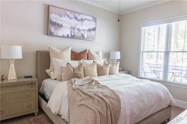 bedroom with carpet floors, multiple windows, ornamental molding, and baseboards