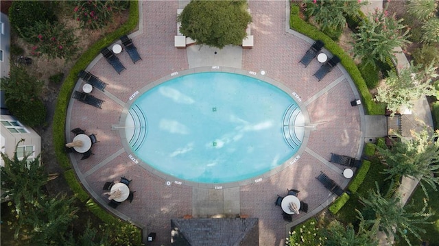 view of property location with a pool