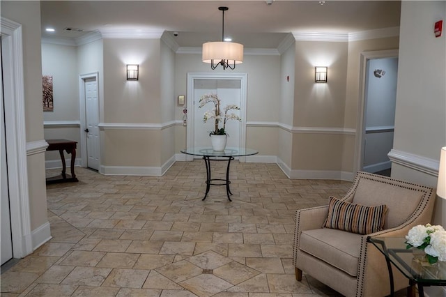 foyer entrance featuring crown molding, light stone finish floors, recessed lighting, baseboards, and a chandelier