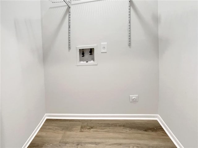 1152 Country Ct, Lawrenceville, GA 30044 - laundry room featuring hookup for an electric dryer, hookup for a washing machine, and wood finished floors