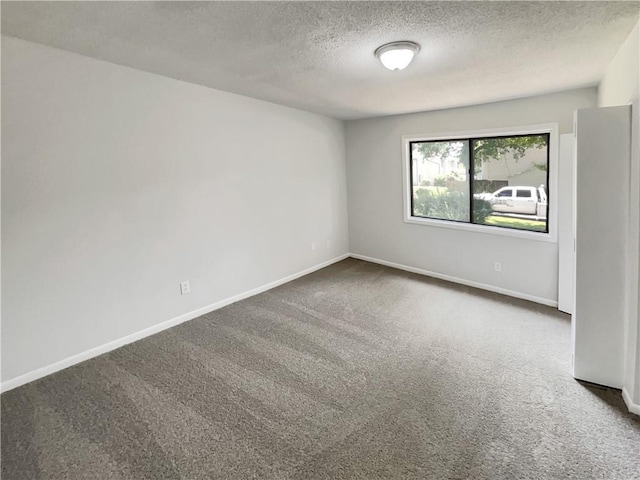 1152 Country Ct, Lawrenceville, GA 30044 - carpeted spare room with a textured ceiling and baseboards