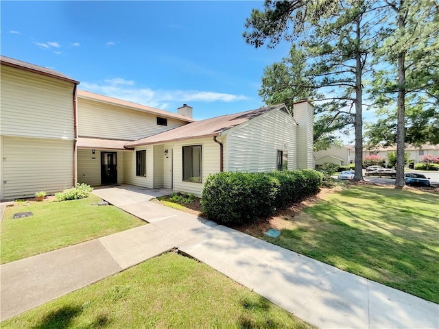 1152 Country Ct, Lawrenceville, GA 30044 - mid-century inspired home with a chimney and a front yard