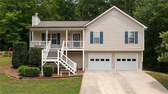 188 Crystal Creek Dr, Jasper, GA 30143 - view of front of house with covered porch, concrete driveway, a garage, a chimney, and stairway