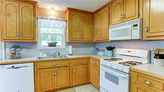 188 Crystal Creek Dr, Jasper, GA 30143 - kitchen with white appliances, light countertops, brown cabinetry, and a textured ceiling