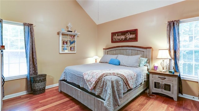 188 Crystal Creek Dr, Jasper, GA 30143 - bedroom featuring vaulted ceiling, multiple windows, and wood finished floors