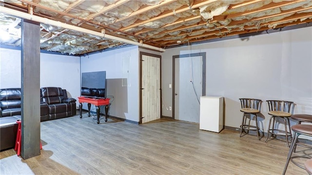 188 Crystal Creek Dr, Jasper, GA 30143 - unfinished below grade area with wood finished floors and fridge