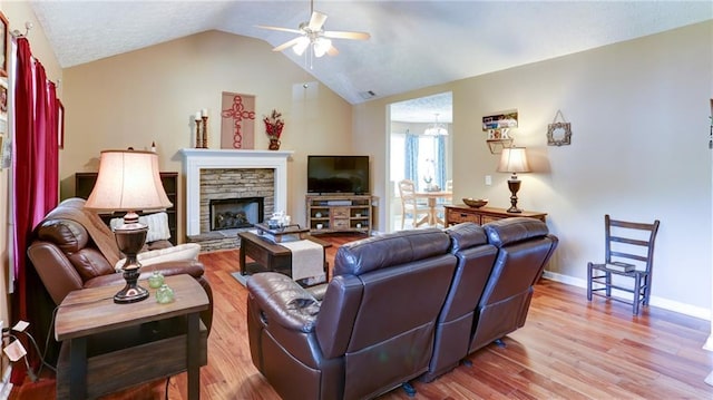 188 Crystal Creek Dr, Jasper, GA 30143 - living room featuring a ceiling fan, wood finished floors, vaulted ceiling, and a fireplace
