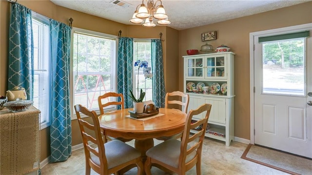 188 Crystal Creek Dr, Jasper, GA 30143 - dining room with a chandelier and a textured ceiling