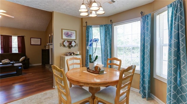 188 Crystal Creek Dr, Jasper, GA 30143 - dining area with a chandelier, a textured ceiling, and a ceiling fan