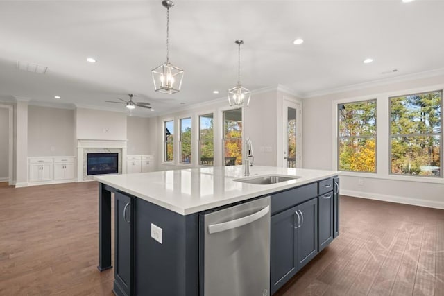 kitchen with stainless steel dishwasher, crown molding, a sink, and ceiling fan with notable chandelier