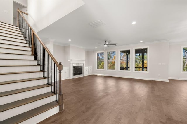 unfurnished living room featuring plenty of natural light, ornamental molding, ceiling fan, and recessed lighting