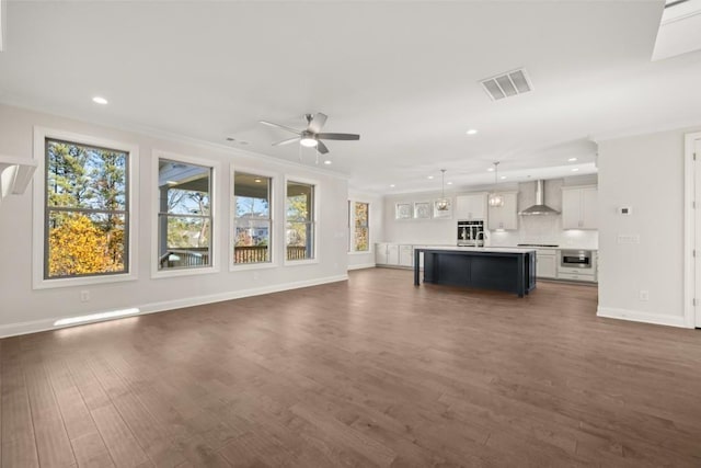 unfurnished living room featuring visible vents, recessed lighting, plenty of natural light, and ceiling fan