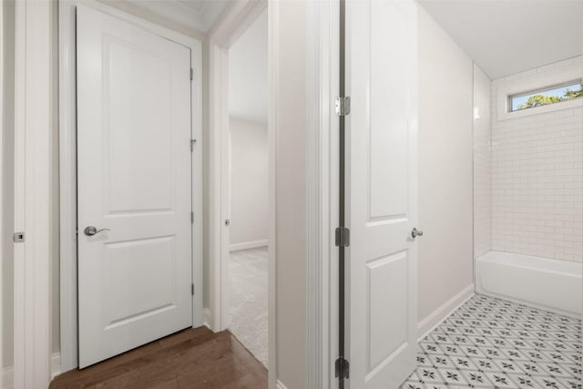 bathroom featuring baseboards and wood finished floors