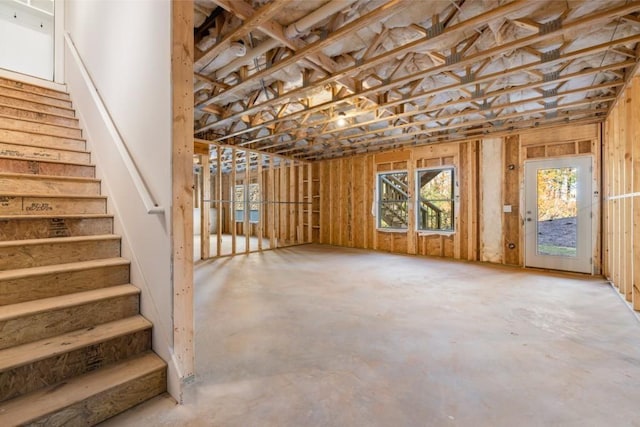 below grade area with stairs and plenty of natural light