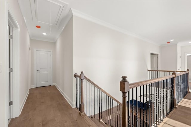 hall featuring attic access, wood finished floors, baseboards, an upstairs landing, and recessed lighting