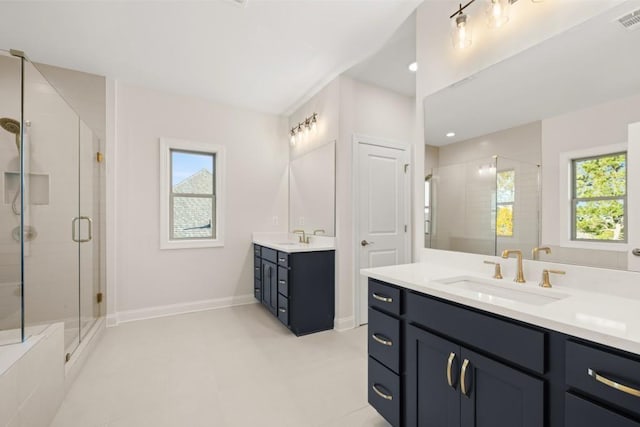 full bath featuring a sink, visible vents, a stall shower, and two vanities