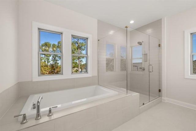 full bath featuring tile patterned floors, a shower stall, recessed lighting, and a bath