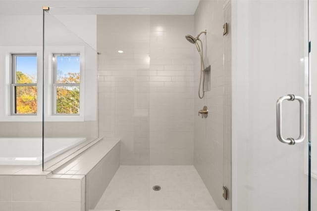 full bath with a shower stall