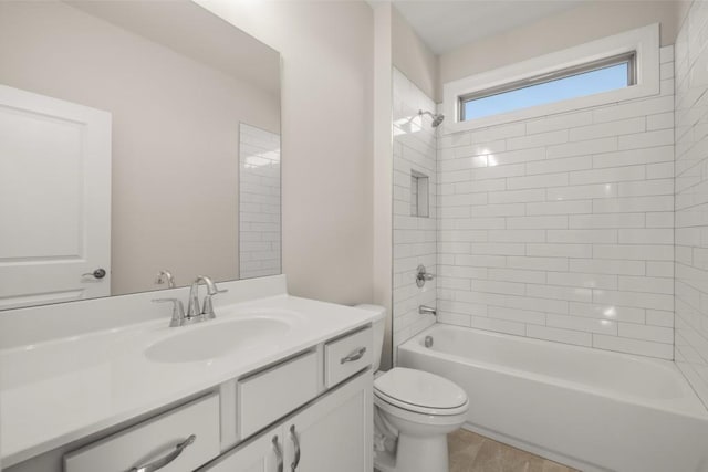 full bath with vanity, washtub / shower combination, and toilet
