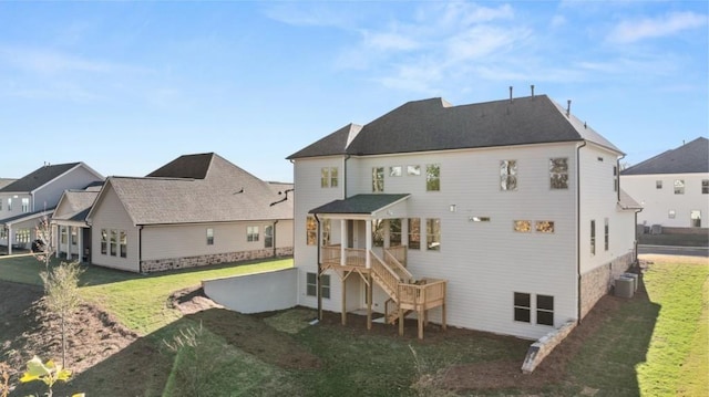 back of house with a lawn, cooling unit, and stairway