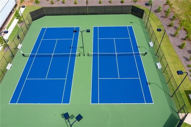 view of tennis court with fence