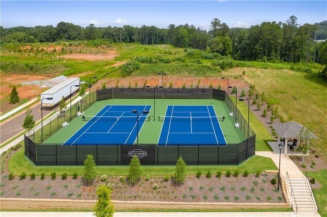 view of tennis court with fence