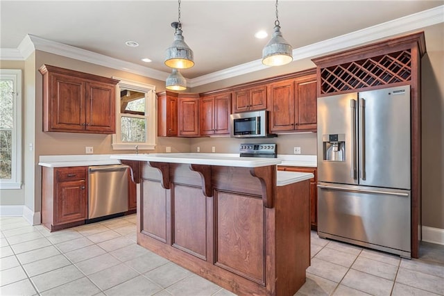 kitchen featuring crown molding, a kitchen bar, light countertops, light tile patterned floors, and appliances with stainless steel finishes