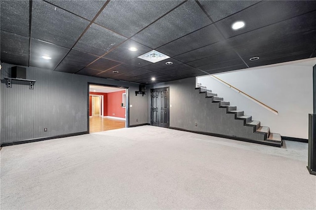 basement with stairway, carpet flooring, baseboards, and visible vents