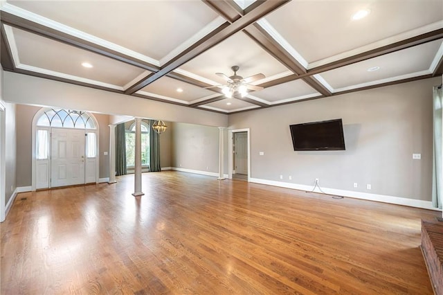 unfurnished living room with light wood finished floors, baseboards, decorative columns, beam ceiling, and coffered ceiling