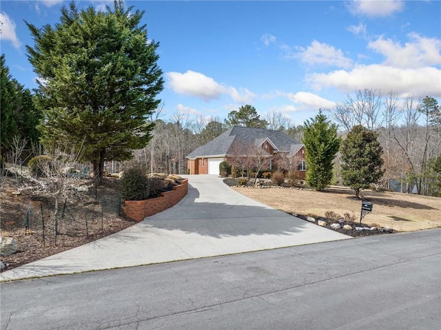 view of front facade with concrete driveway and a garage