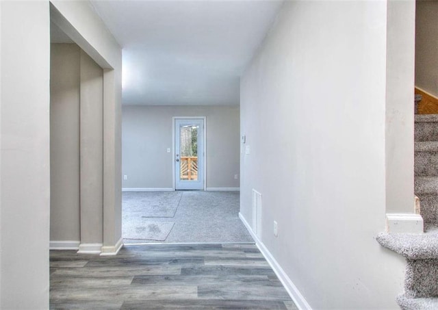 hallway with wood-type flooring