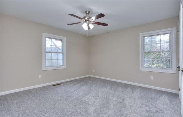 carpeted empty room with ceiling fan