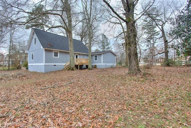 rear view of house with a wooden deck