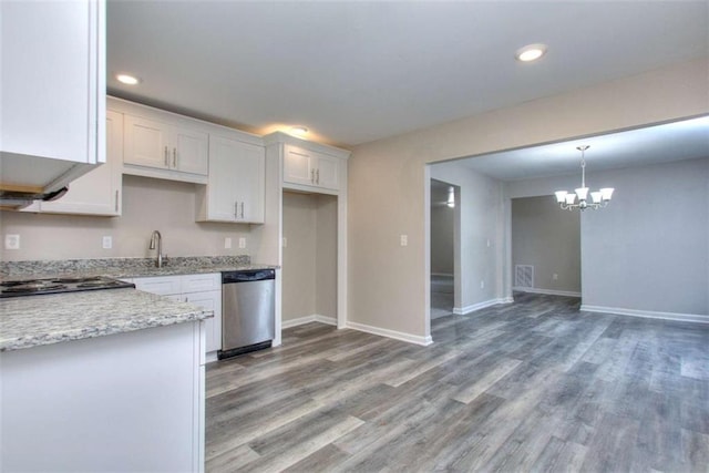 kitchen featuring white cabinetry, stainless steel appliances, a chandelier, pendant lighting, and light stone counters