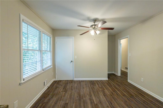 unfurnished room with ceiling fan, crown molding, and dark hardwood / wood-style flooring