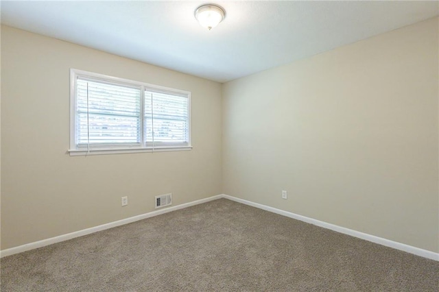 unfurnished room with carpet floors