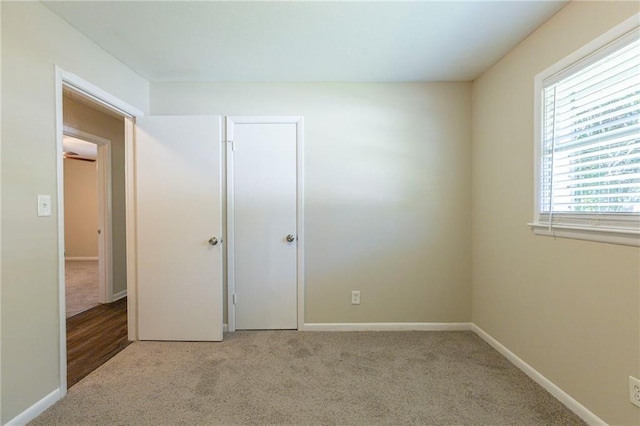 unfurnished bedroom with light carpet