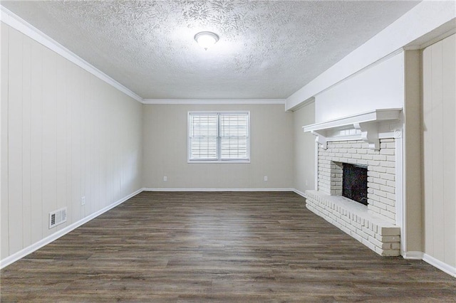 unfurnished living room featuring a fireplace, ornamental molding, and dark hardwood / wood-style flooring