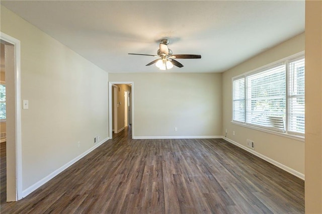 empty room featuring ceiling fan and dark hardwood / wood-style floors