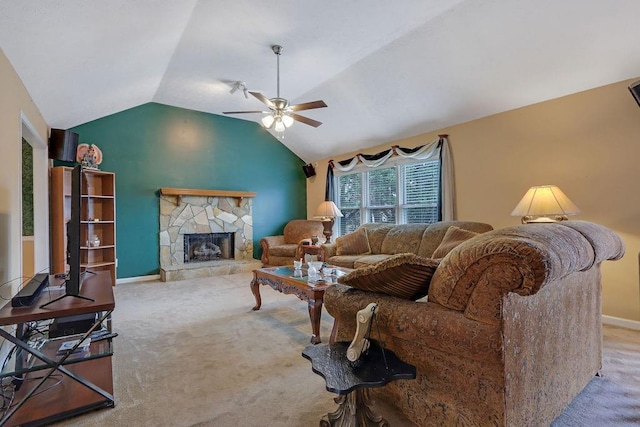 living area with a fireplace, lofted ceiling, carpet flooring, ceiling fan, and baseboards