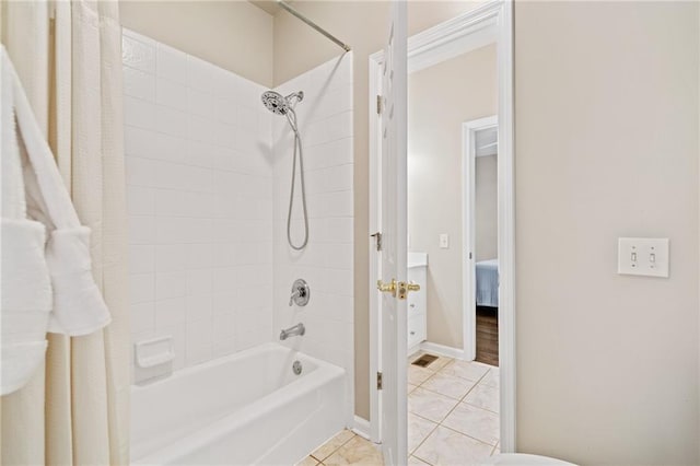 997 Thousand Oaks Bnd NW, Kennesaw, GA 30152 - full bath featuring tile patterned floors, bathtub / shower combination, and baseboards