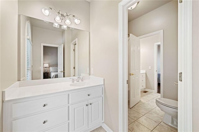 997 Thousand Oaks Bnd NW, Kennesaw, GA 30152 - bathroom featuring connected bathroom, vanity, toilet, and baseboards